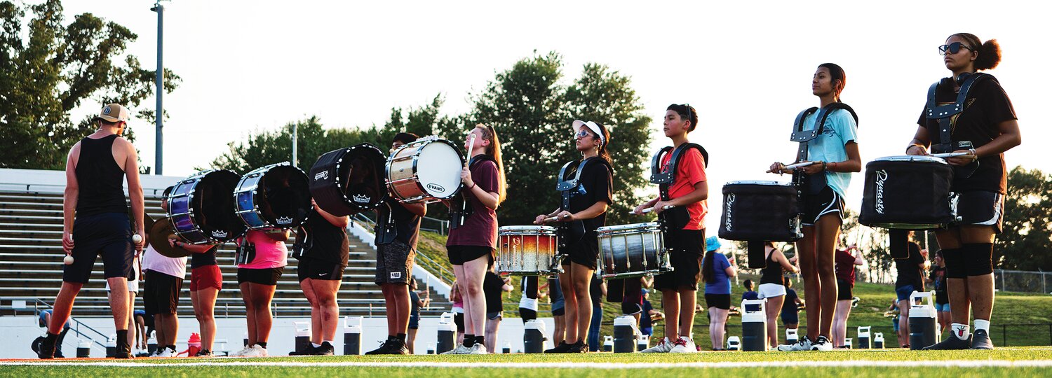 The Mineola High School Sound of the Swarm has kicked off its effort to win a fourth straight marching band state title, on the heels of winning its second straight honor band award. Rehearsals began last week. The percussion section practices its parts.